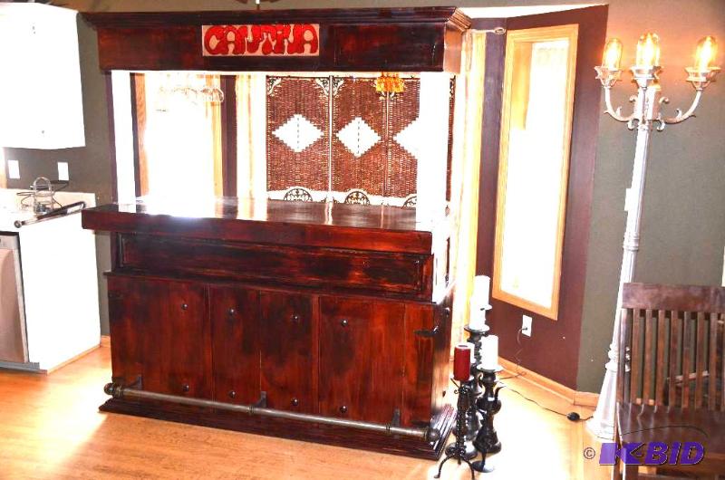 lot 1 image: Wood Cantina Bar with a brass rail on...