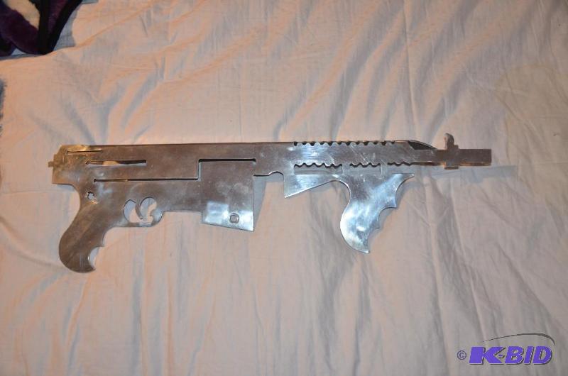 lot 110 image: Metal stamp of a gun 24" long...