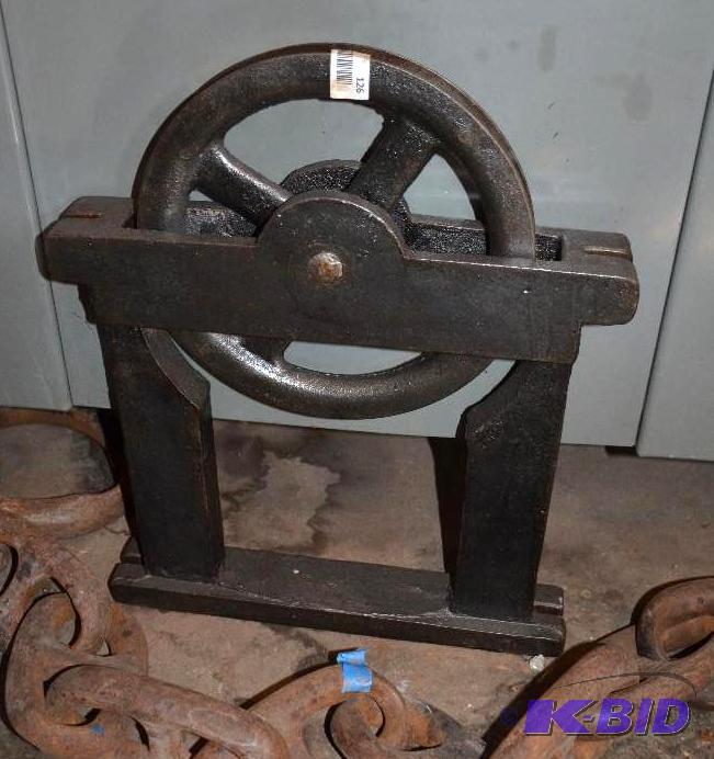 lot 126 image: Iron pulley 17x22 from the old Pillsbury A mi...