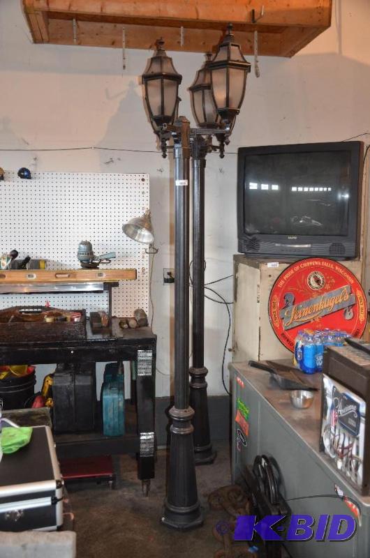 lot 129 image: Yard pole lamp 96" tall. One light is br...