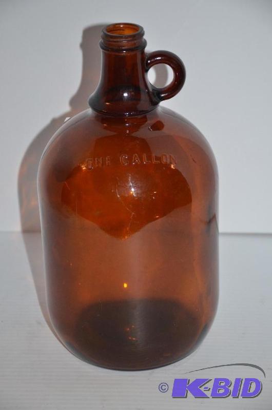lot 15 image: Large antique brown gallon glass bottle...