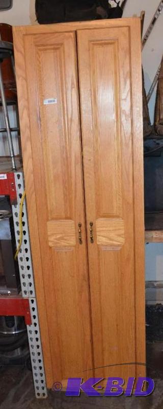 lot 179 image: Oak wood cabinet 24x24x84"...