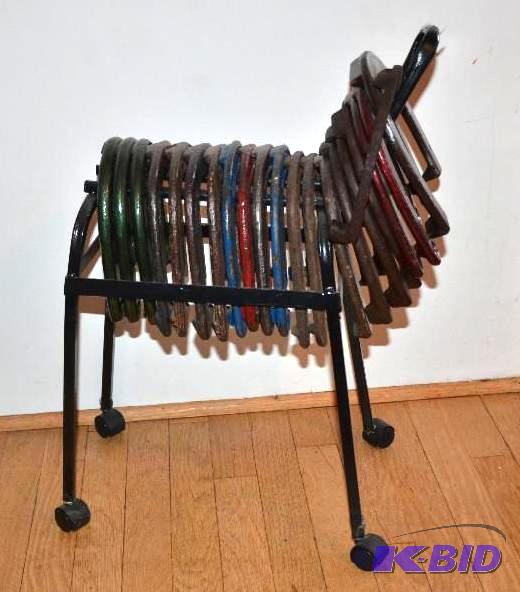 lot 2 image: 21 horse shoes on a a metal stand, lo...