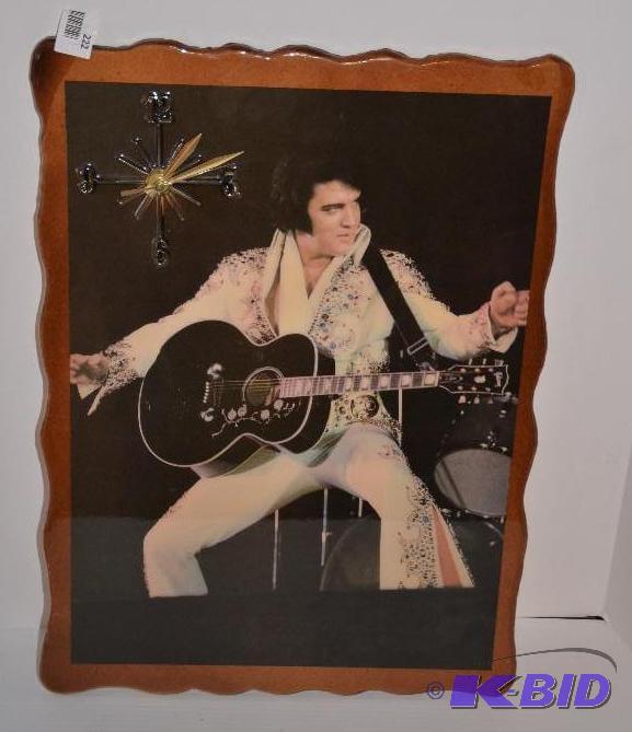 lot 222 image: Elvis clock 15x22" on wood base...
