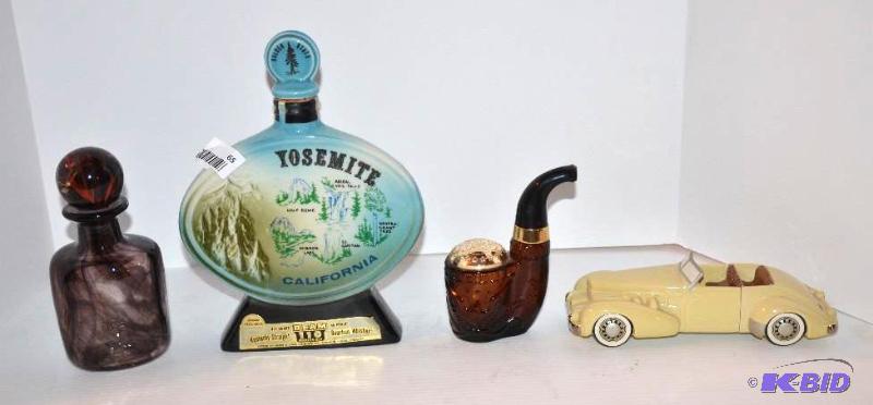 lot 65 image: 4 decanters  Yosemite, 1937 Cord car, pipe, v...