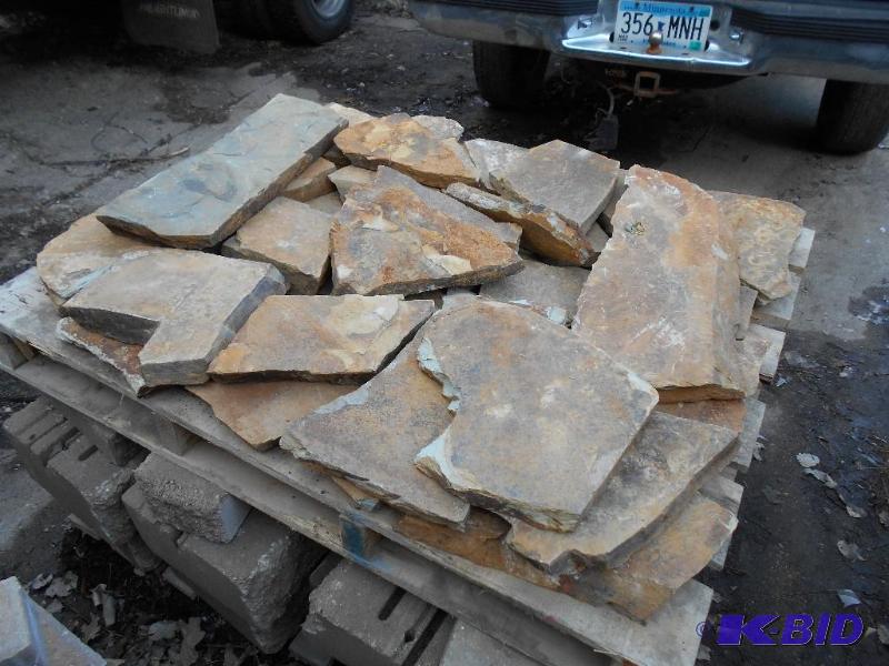 lot 34 image: Pallet of brick on the top in the photo.