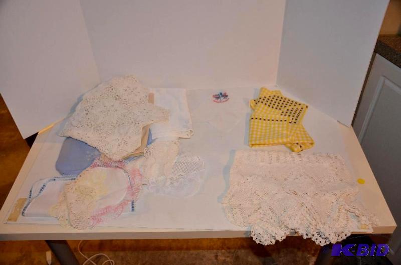 lot 155 image: Handmade doilies and table linens...