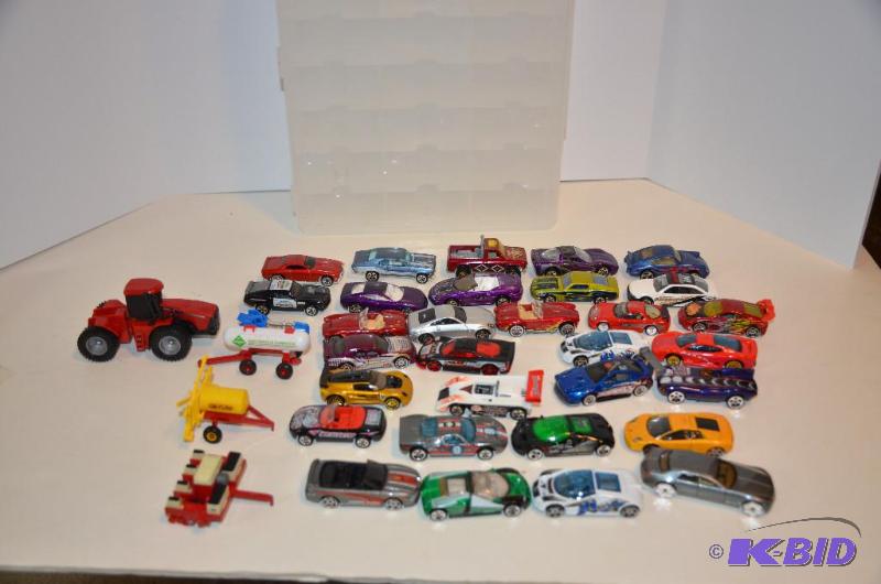 lot 174 image: Case of 31 Hot Wheels cars & 3 Ertl farm ...