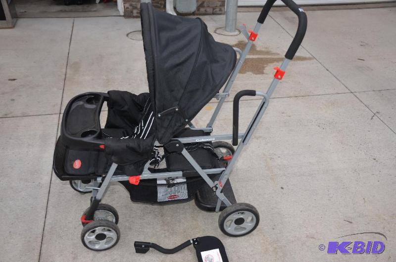 lot 204 image: Joovy caboose stand-on tandem stroller, model...