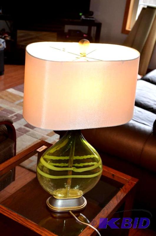 lot 21 image: Green Glass lamp. 28&quott...