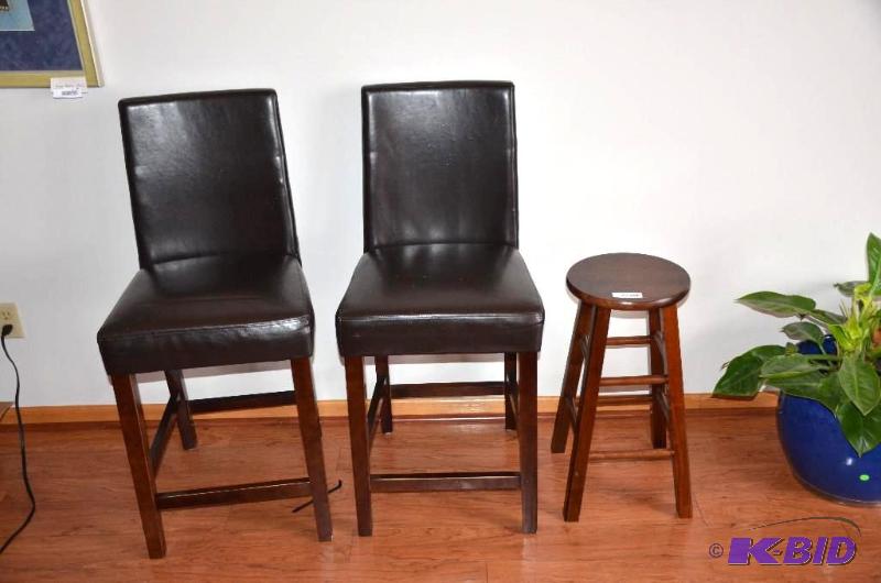 lot 28 image: 2 bar stools with leather seats. From Becker...