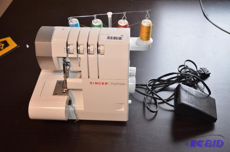 lot 41 image: Singer Pro finish Surger. Model 14CG754....