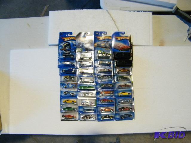 lot 56 image: Hot Wheels Collection 32 Piece Set with 2 Mys...