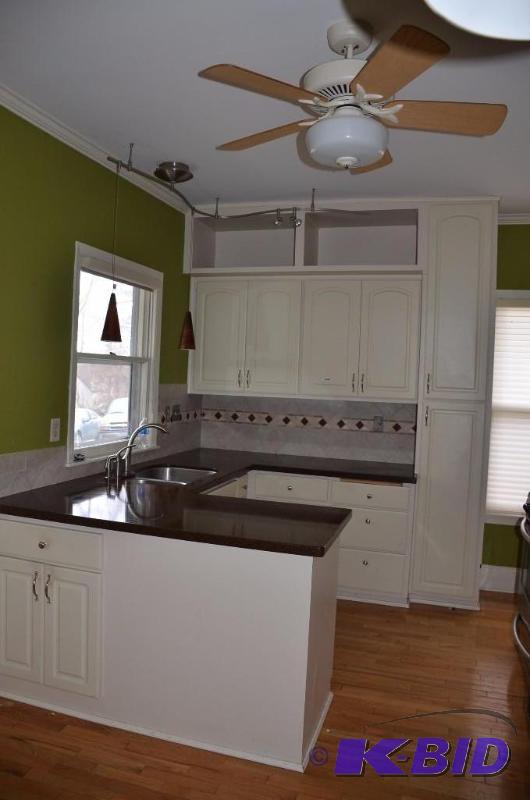 lot 1 image: Kitchen cabinets upper and lower with gra...