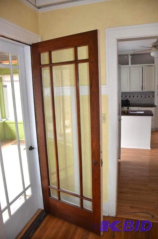 lot 16 image: Two Antique 32" wood doors with glass. O...
