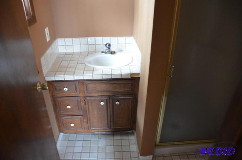 lot 56 image: Sink Cabinet and faucet. 33&quotx22"...