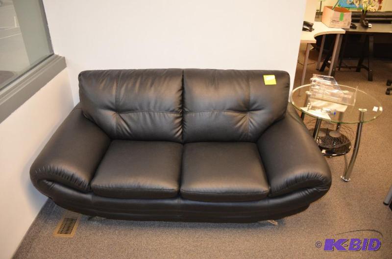 lot 1A image: Black leather couch with metal legs. 69x37x33...