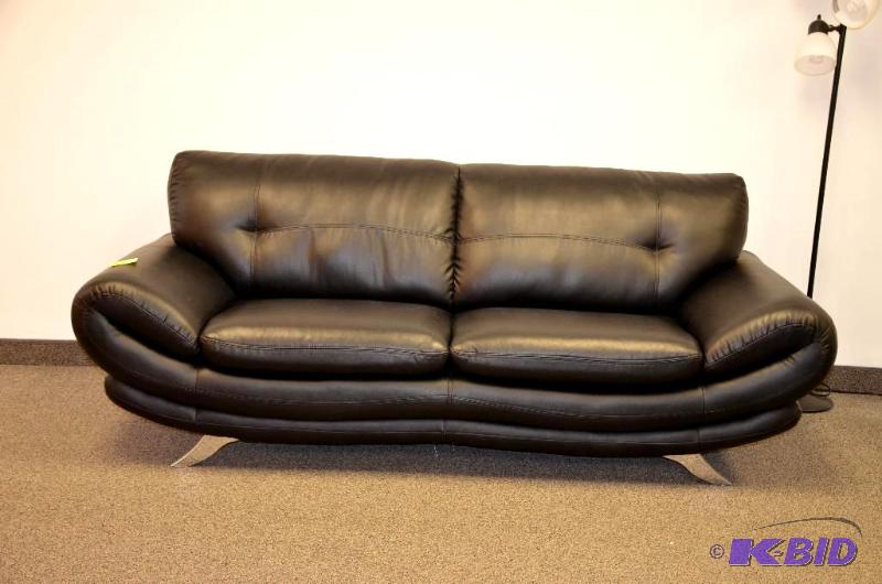 lot 1B image: Large black leather couch with metal legs. 88...