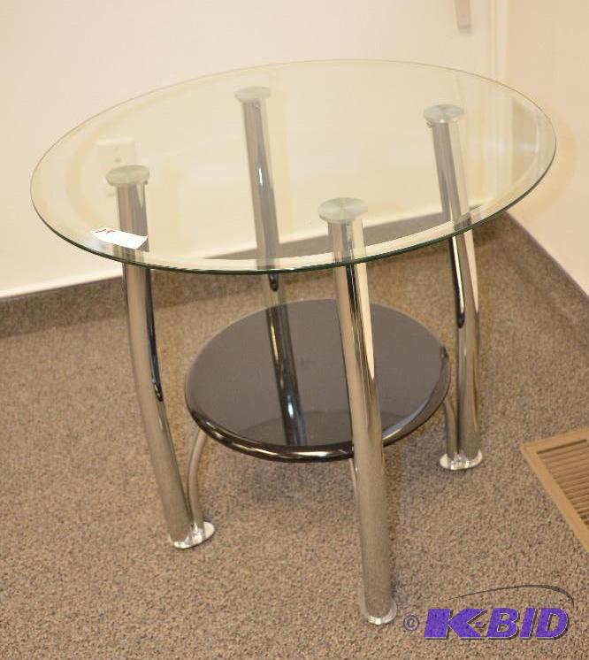 lot 1E image: Circular glass table with metal legs and seco...