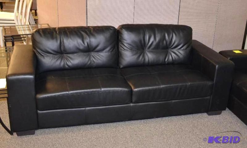 lot 1M image: Black leather couch 82" long...