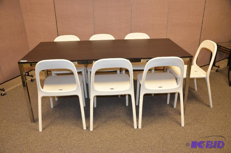 lot 25F image: Black table with metal legs. Comes with 6 whi...