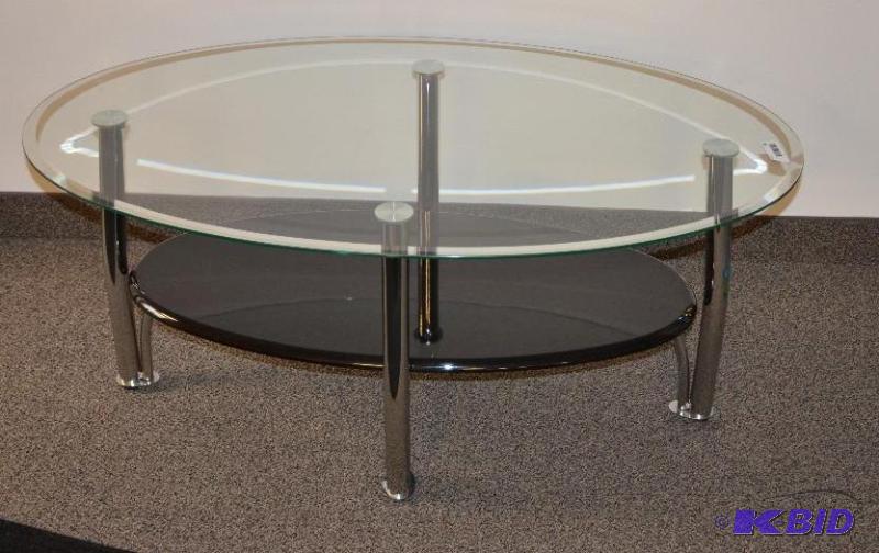 lot 83 image: Glass top coffee table with chrome base 28x48...