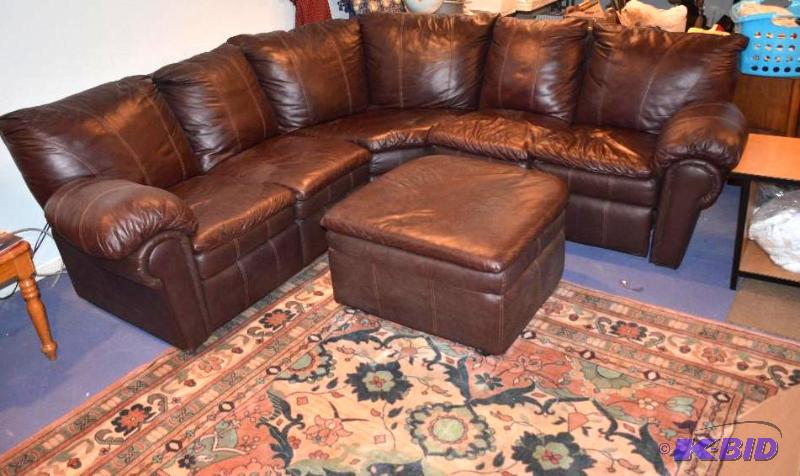 Brown leather sectional couch with foot stool...