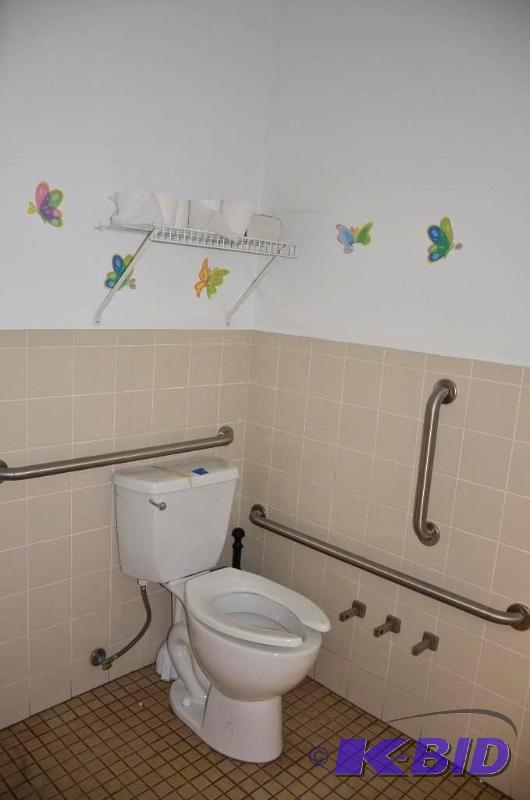 lot 67 image: Toilet 32" t handicap rails and rack abo...