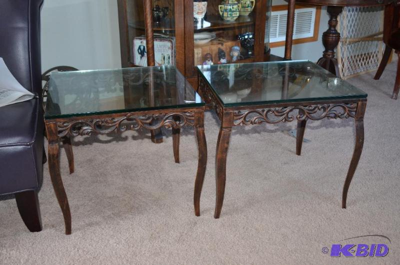 lot 11 image: Two matching Wrought iron tables with glass t...