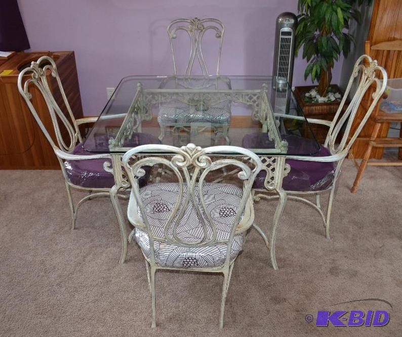 lot 3 image: Glass top table 42x42 wrought iron base...
