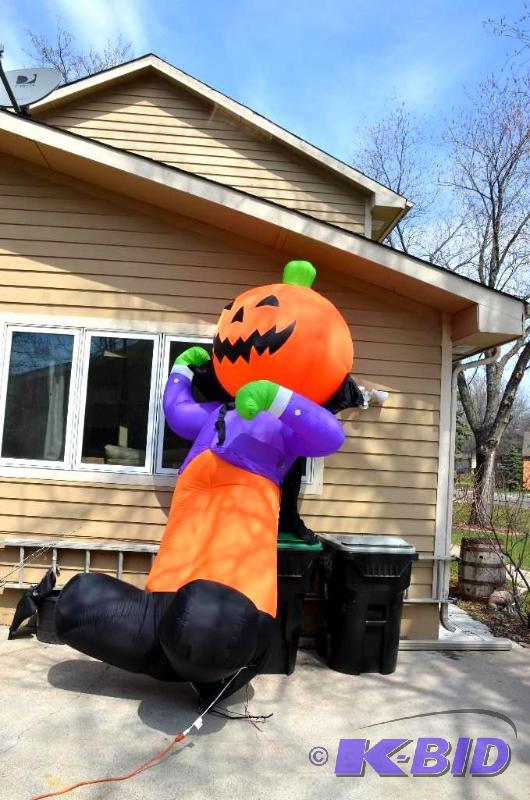 lot 79 image: Pumpkin Lawn decor. 10-12 ft tall inflatable....