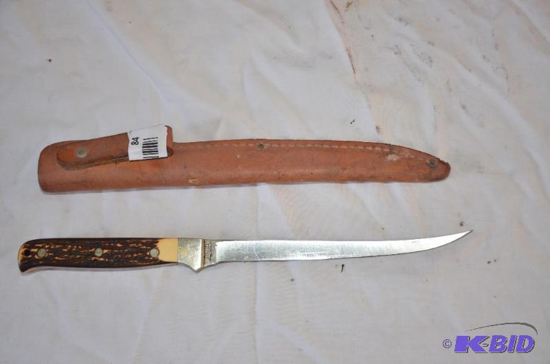 lot 84 image: Uncle Henry Stag handled knife with leather c...