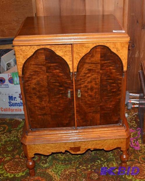 lot 144 image: Wood cabinet says F-1125 (located in first ba...
