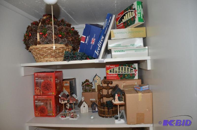 lot 189 image: Two shelves of Christmas decor - baskets, lig...