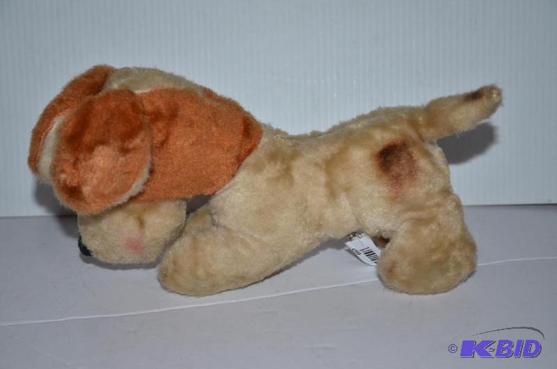 lot 60 image: Vintage stuffed dog with music box bw...