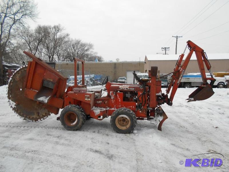 lot 8 image: Ditch Witch R65 4X4 Rock Saw  Backhoe. Runs.