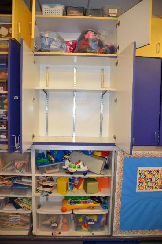 lot 106 image: Contents of cabinets - toys, clothing...