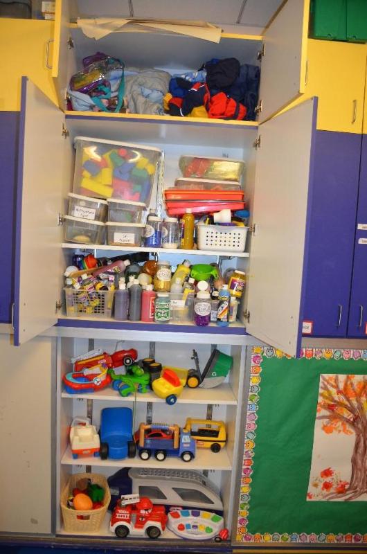 lot 107 image: Contents of cabinet - toys, paint, glitter, a...