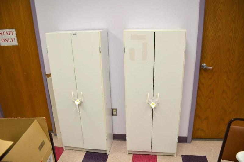 lot 144 image: 2 wood cabinets 12x24x59". Contents is n...