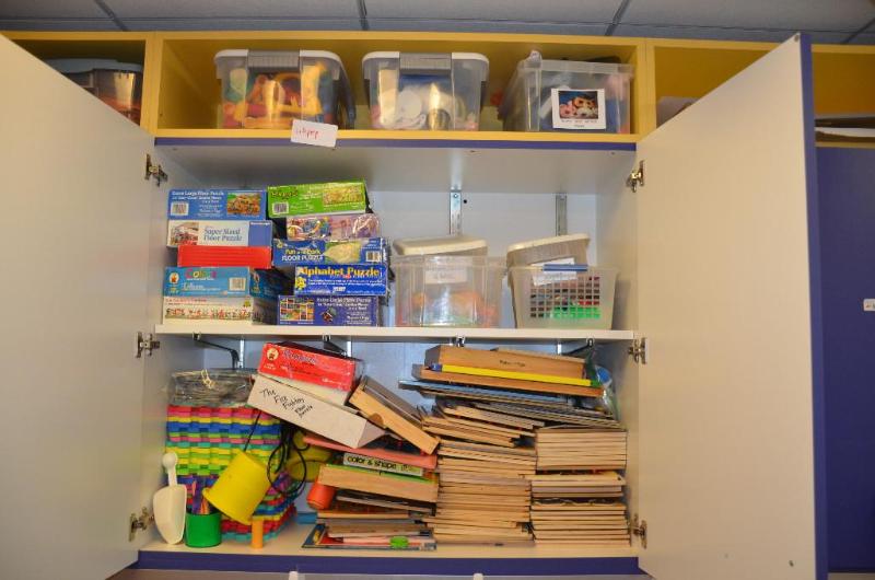 lot 195 image: Contents of shelves - Many wooden puzzles, pu...