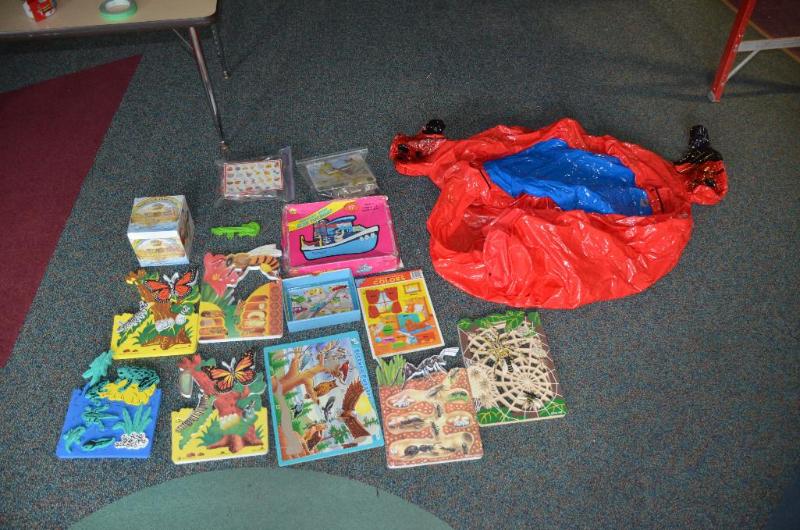 lot 235 image: Puzzles & a blow up toy...