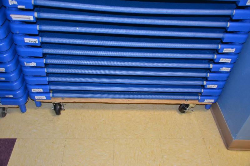 lot 34 image: 7 childrens cots with rolling cart 50x20&quo...