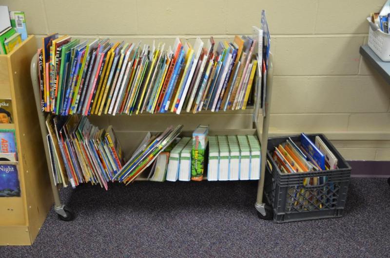 lot 67 image: Metal book cart with large lot of childrens ...