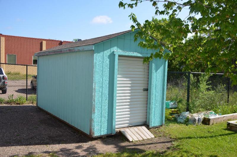 lot 9 image: Shed with metal rolling door and buil...