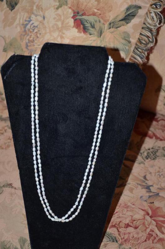 lot 152 image: Large double strand of pearls. Each strand is...