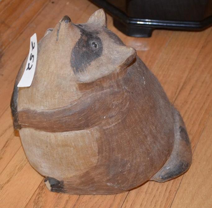 lot 252 image: Handmade pottery raccoon. 10" tall...