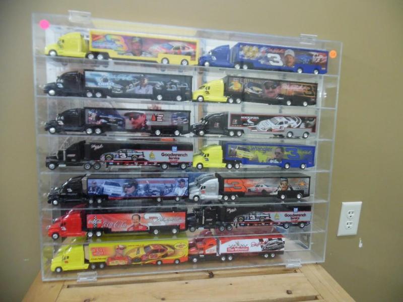 lot 58 image: Die-cast semi trucks in display cabinet