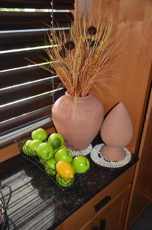 2 clay pots, wire basket, shell coaster. Frui...