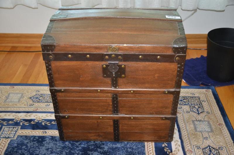 Antique wood camel back trunk purchased in Ge...