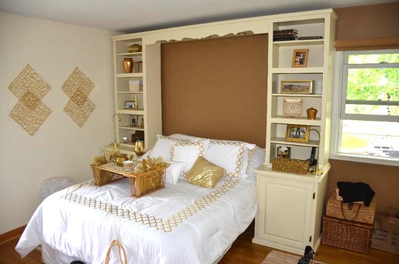 Custom wood cabinets  bookshelf system aroun...